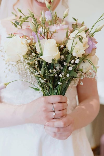 bride photographed with flowers on her wedding day