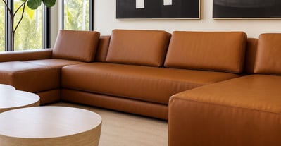 Tan leather sectional sofa with clean lines, by Solo Home Decor in a modern space.