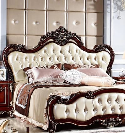 a handcarved wooden bed with a large headboard and a handcarving bed with a white bedding