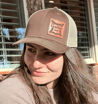 a woman with long hair and a hat on