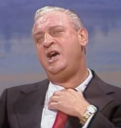 a man in a suit and tie with a red tie