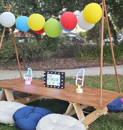teepee picnic table rissler theme with balloon garland