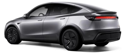 a silver tesla model with a rear view of the vehicle