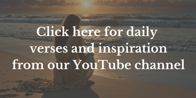 Woman on a beach watching the sunset.