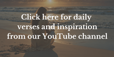 Woman on a beach watching the sunset.