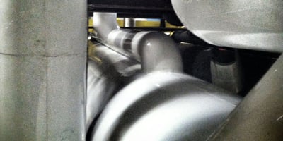 Large-scale commercial thermal insulation installation on industrial HVAC equipment and mechanicals