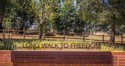 a long walk to freedom sign in a park