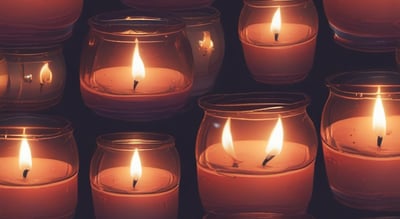 A lit Verzenay Bin 32 hand-poured soy candle is situated on a wooden surface. In the background, a Christmas tree adorned with silver baubles and glowing lights adds a festive atmosphere.