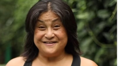 a woman with a black top and a black top
