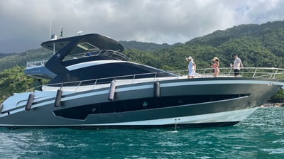 a boat 70 ft with people on it in the water