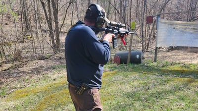 Man using self-defense firearm (Carbine) on range.