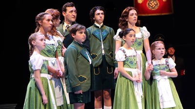 a group of people standing on a stage
