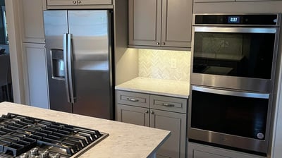 a kitchen with a stove top oven and a stove top oven