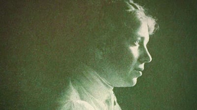 A grainy historical photo of a young and studious Harriet Brooks in profile