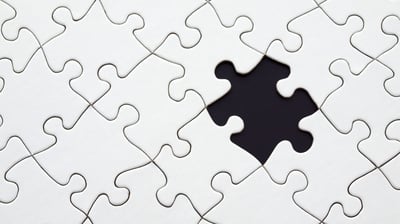 a puzzle piece of puzzle pieces with a hole in the middle symbolizing personal developement