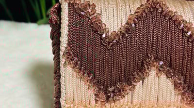 a purse with a heart shaped design on it