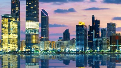 a city skyline with a river and a city skyline