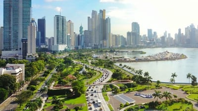 a city skyline view of a city with a river and a city in the background