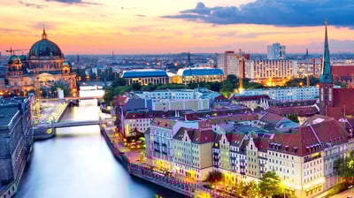 a cityscape of a river with a bridge and a bridge over it