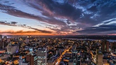 a cityscape of buildings and a sunset