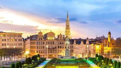 a view of a city with a clock tower in the background
