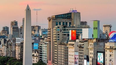 a cityscape of a city with a tall obelisk obelisk