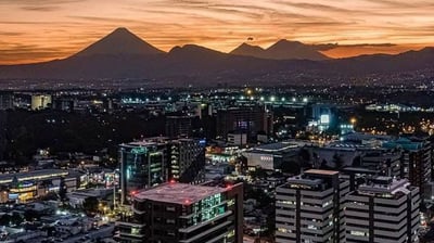 a city skyline view of a city at night