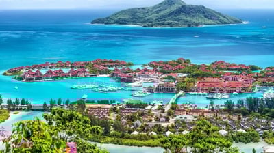 a view of a small island in the middle of the ocean