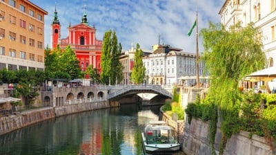 a boat on the river in a city