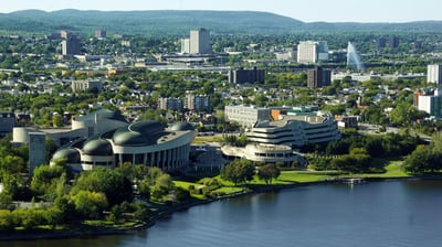a cityscape of a large building with a large body of water