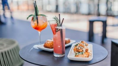 a table with two drinks and a drink