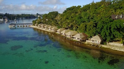 a small island with a boat in the water