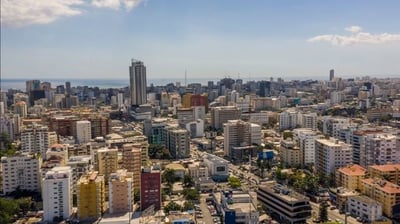a city skyline view of a city with a view of the ocean