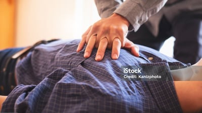 a man in a suit and tie is holding a woman's hand