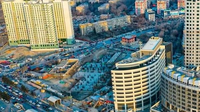 a cityscape of a city with a lot of traffic
