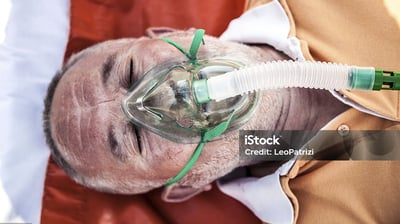 a man in a medical mask with a breathing apparatus