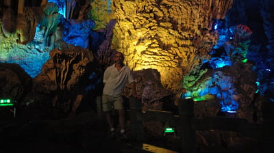 Nick Billington at the colourful Reed Flute Caves, Guilin, China