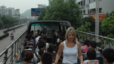 Tracey billington on an open top bus in Guilin, China