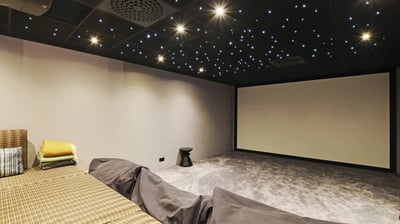 Private cinema room at Villa Bastille with full-width screen