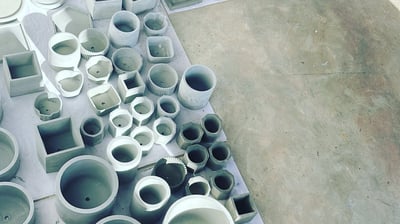 a bunch of different types of clay pots