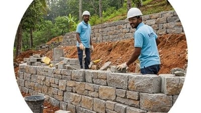 symphony maintenance and property management employee doing retaining wall construction work