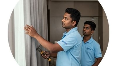 symphony maintenance and property management employee doing curtain work