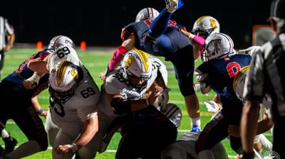 a group of people playing a game of football