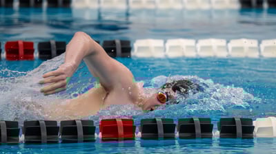 a swimmer in a swimming pool with a lot of water