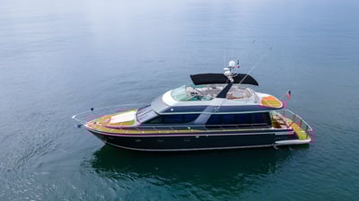 a luxury boat in the water with a flag on it