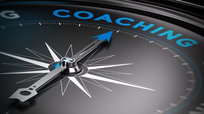 a compass - shaped clock with the words coaching on it