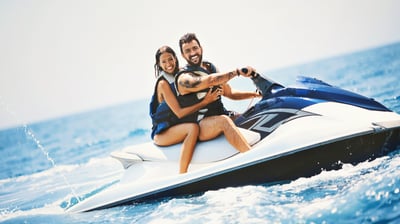 a man and woman riding a jetski in Tenerife