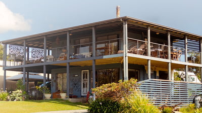 a wooden house with a deck