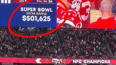 a football player is shown on a large screen