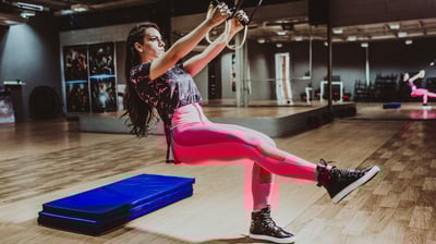 a woman in pink leggings and a pink top